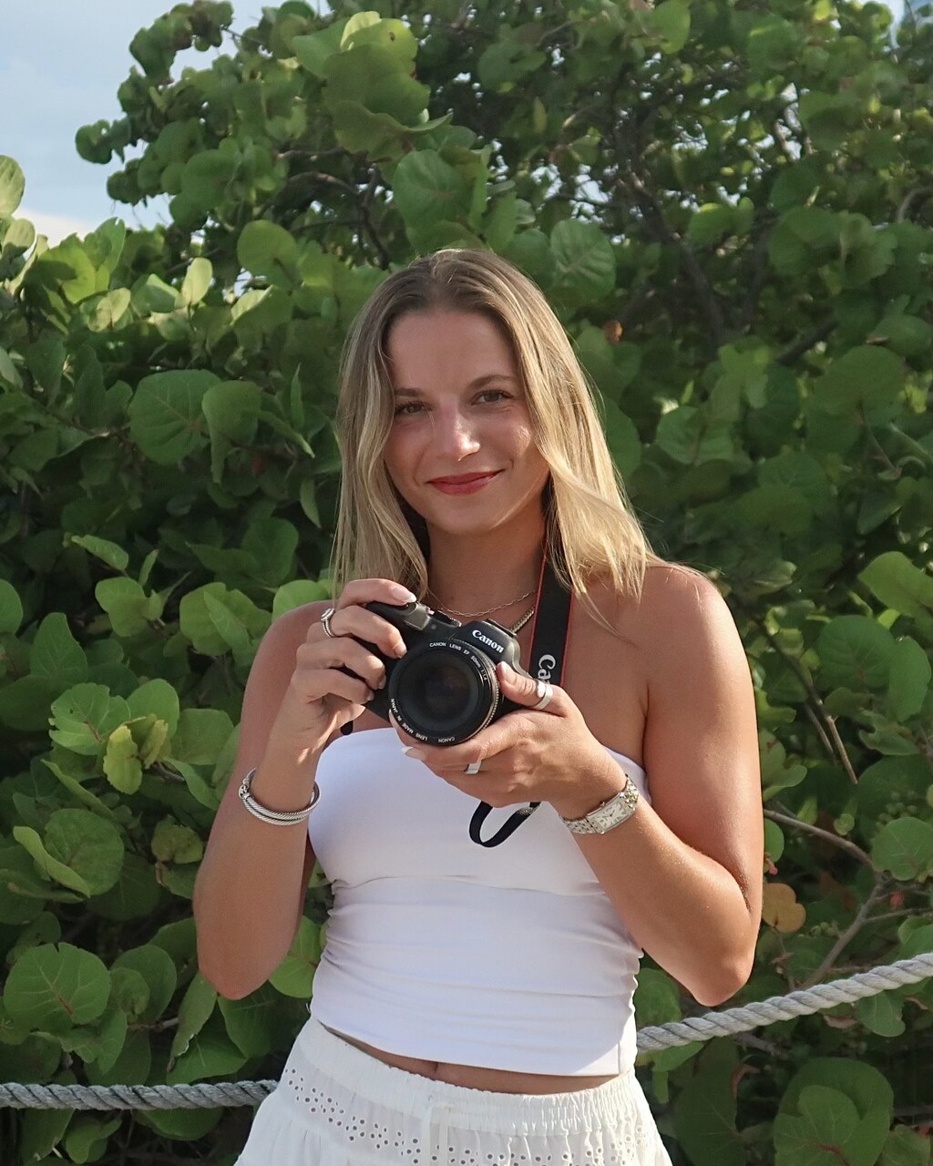 Portrait of the photographer holding a film camera